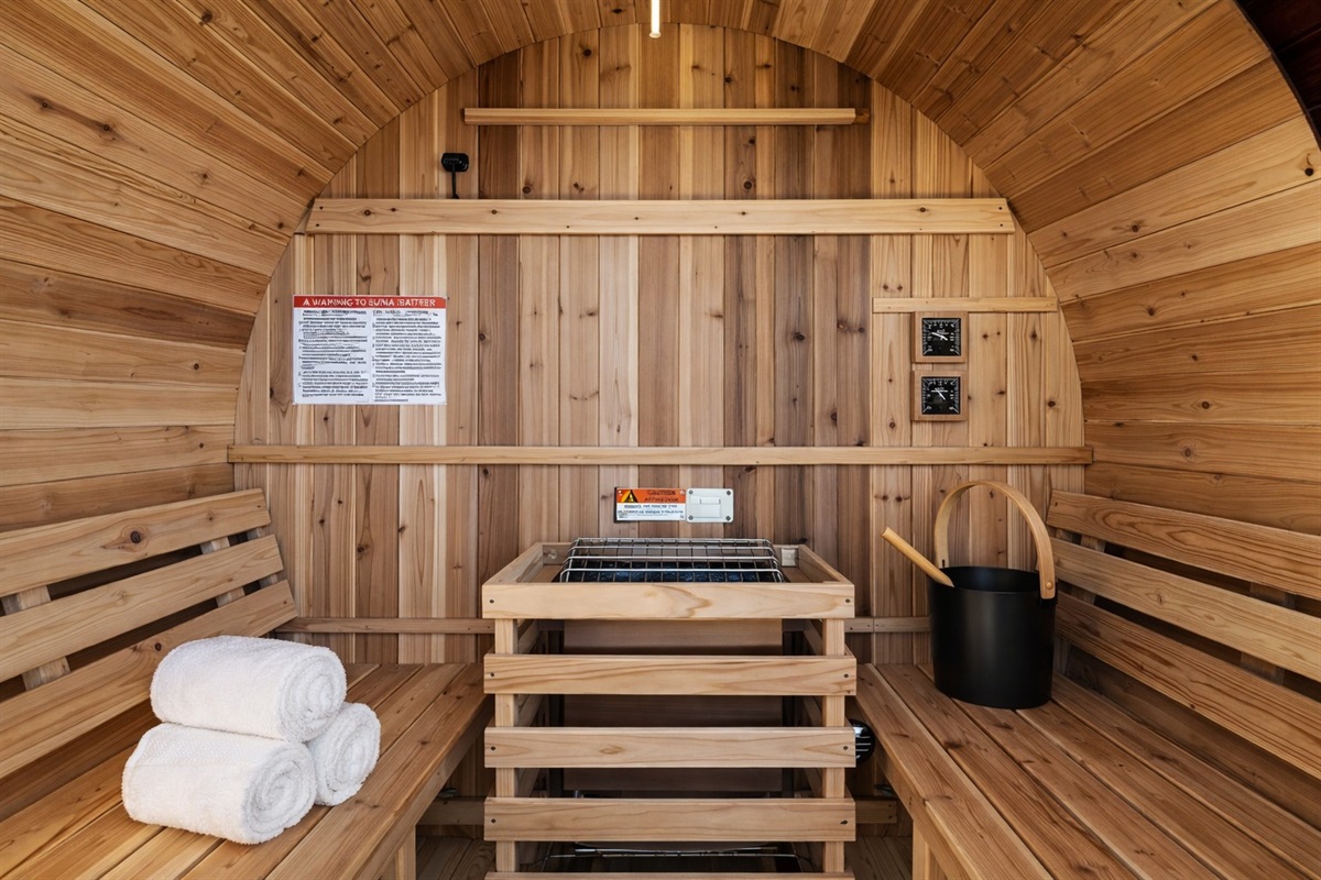 {Sauna} Private 4- person barrel sauna with bench seating, towels provided, and a true spa-style experience to unwind and reset.