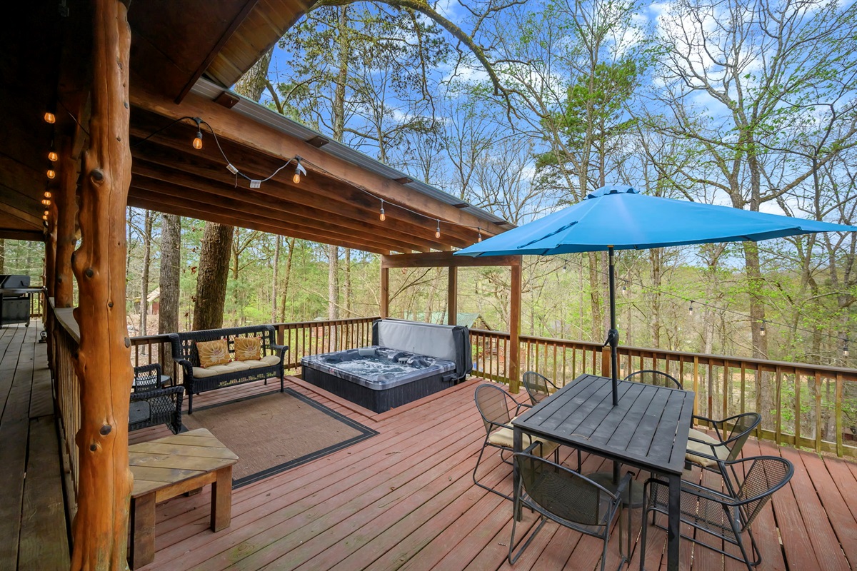 Hot Tub and Outside Dining Table with Umbrella and Seating