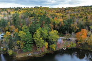 The house from the lake in the fall