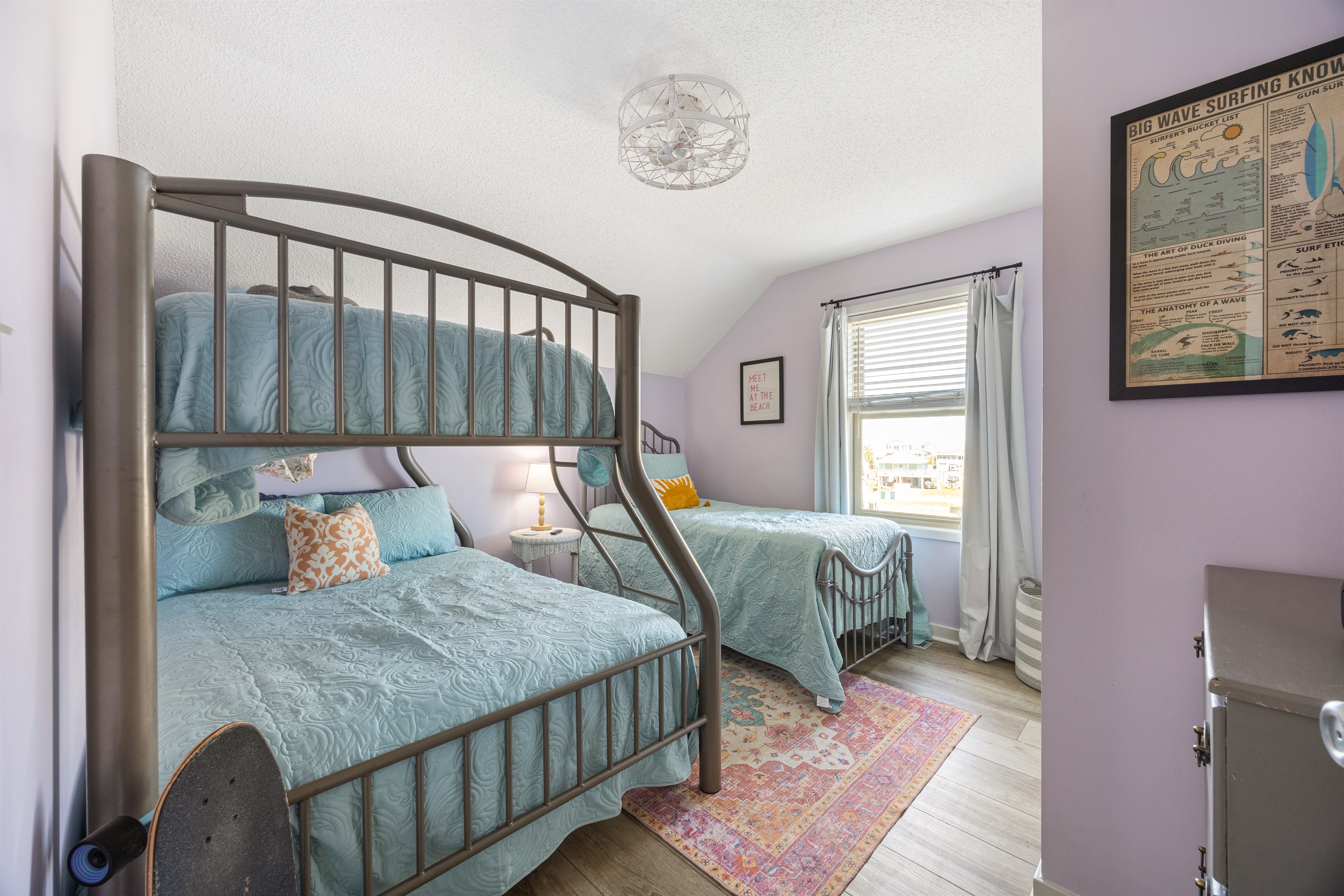 Guest bedroom with bunk beds, extra twin, TV, and Xbox—perfect for families.