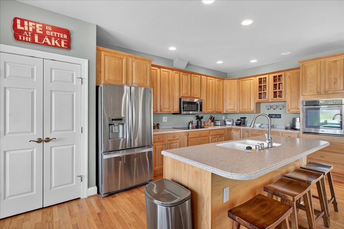 Fully equipped kitchen with modern appliances and island seating.