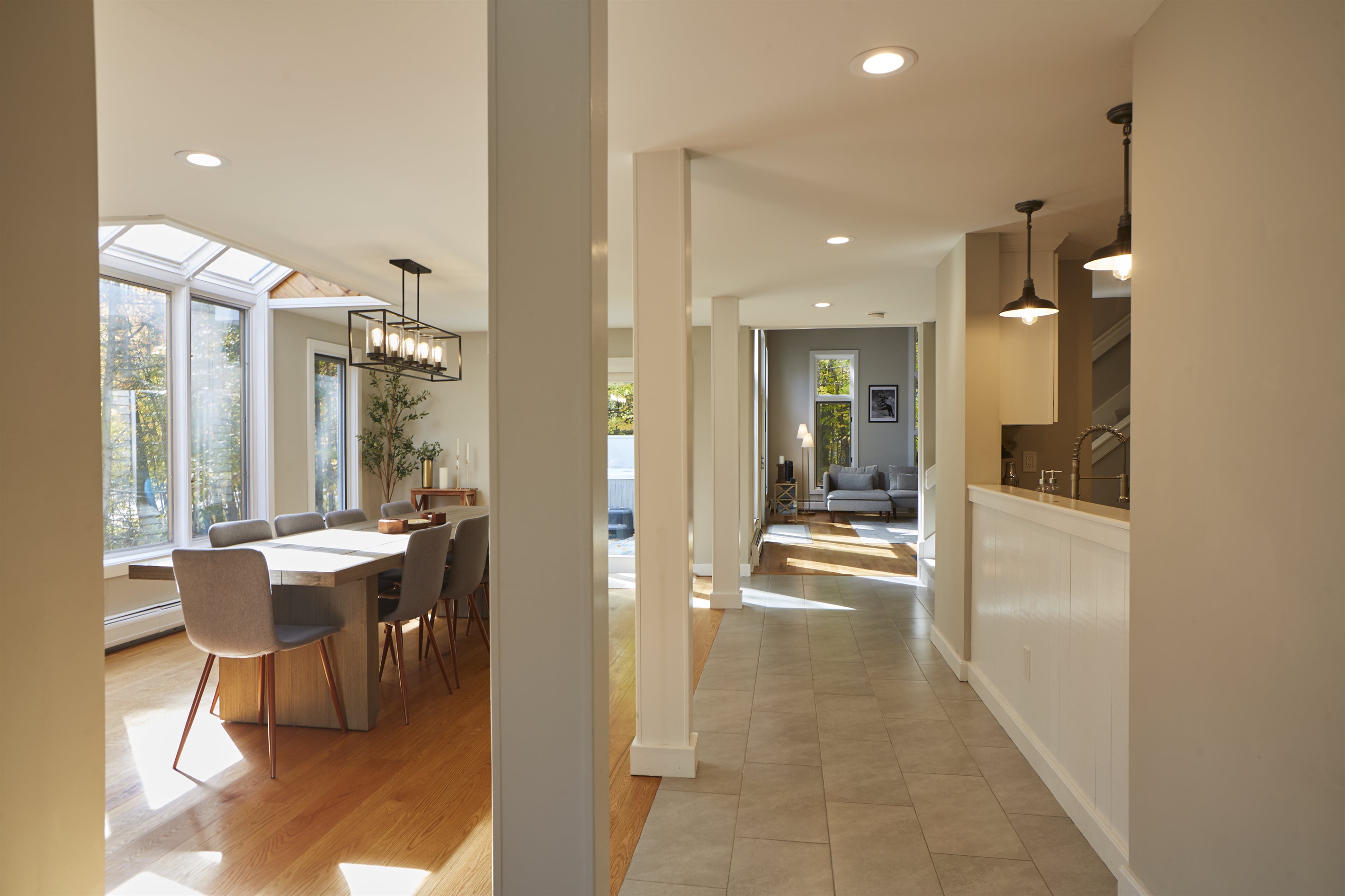 Lovely hallway from the entrance area and mudroom to the dining and living room areas.