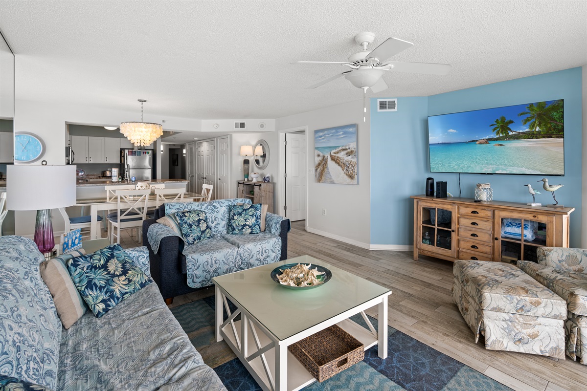 Open Living Room with Large TV and balcony access