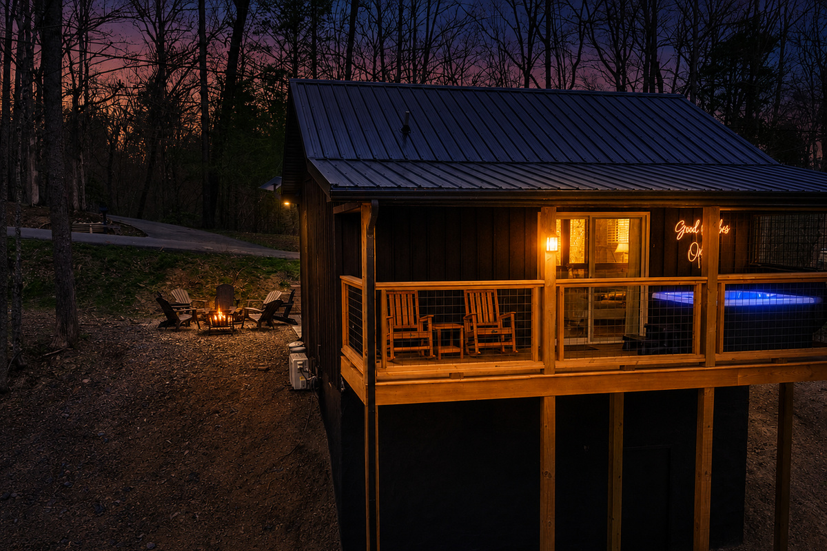Back deck faces woods, enjoy the hot tub and rocking chairs as you unwind