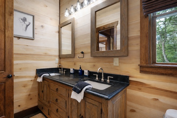 A well-appointed guest bathroom featuring rustic charm and modern fixtures.