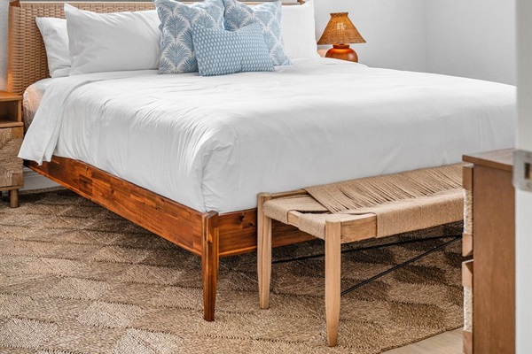 Soft coastal tones and natural textures create a serene bedroom retreat, perfect for restful nights and easy mornings.