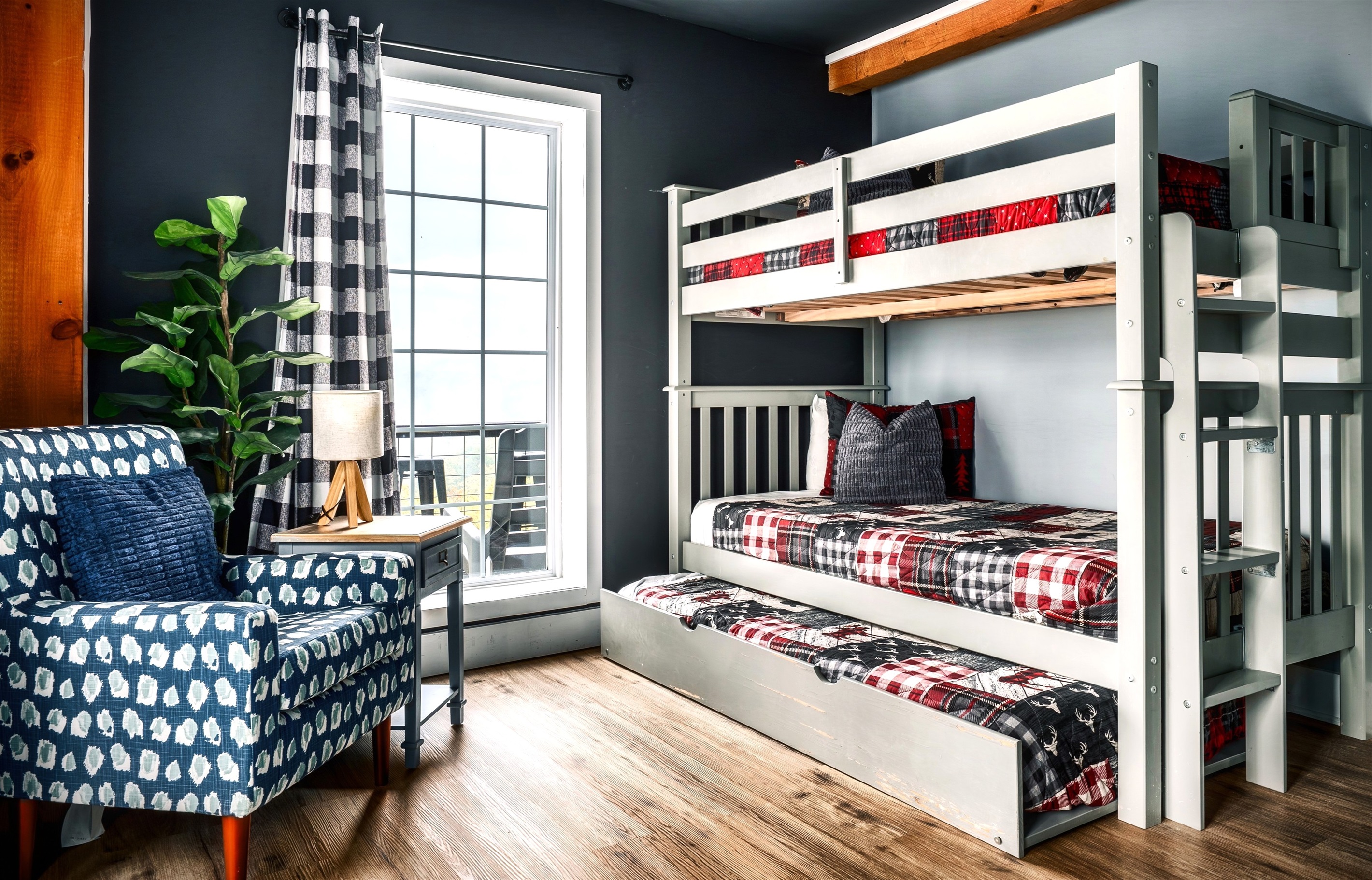 A different angle of secondary bedroom #1 in the basement where guests can look out that big window and enjoy the amazing mountain view - Sleeps 3.
