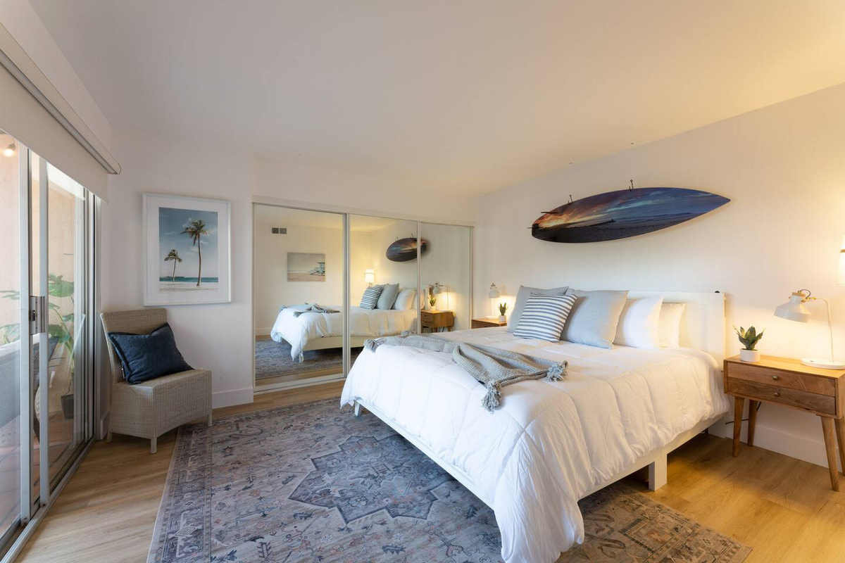 Master bedroom with custom art piece and lots of closet space 