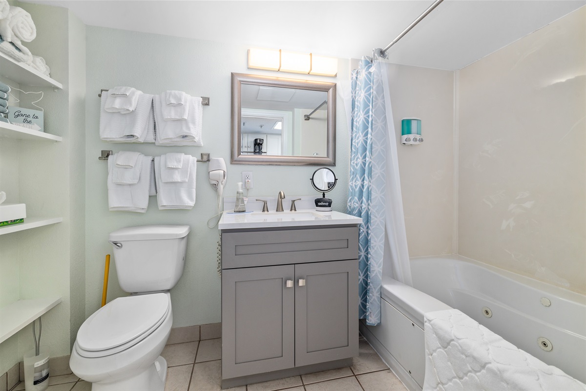 Bathroom with Tub Full bathroom with tub — perfect for a relaxing soak after a day in the ocean or pools. Clean, bright, and family-friendly bathroom with tub/shower combo. Fresh towels and toiletries provided for a worry-free stay.