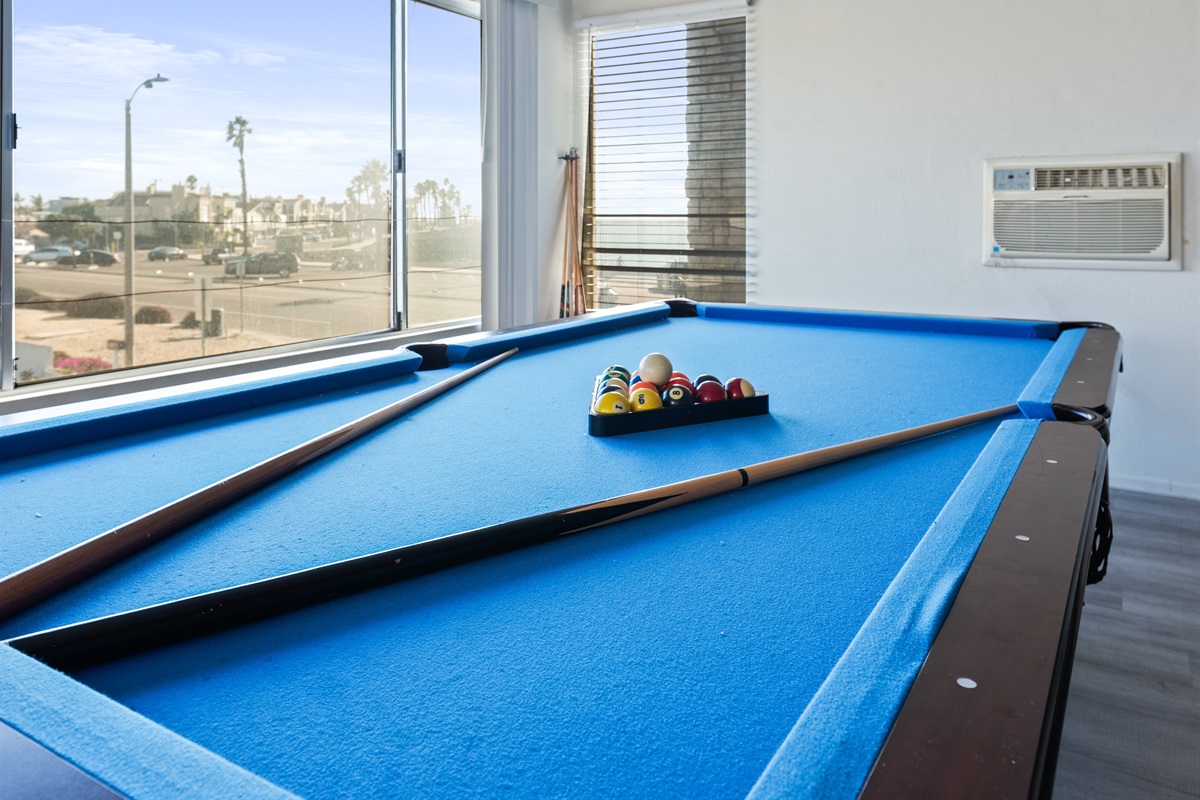Slate pool table with blue felt—perfect for friendly games anytime