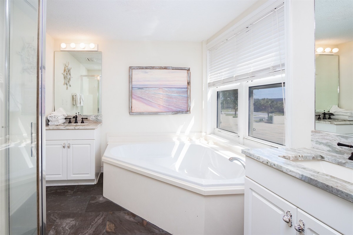 Primary Bathroom with 2 vanities, soaker tub and stand up shower