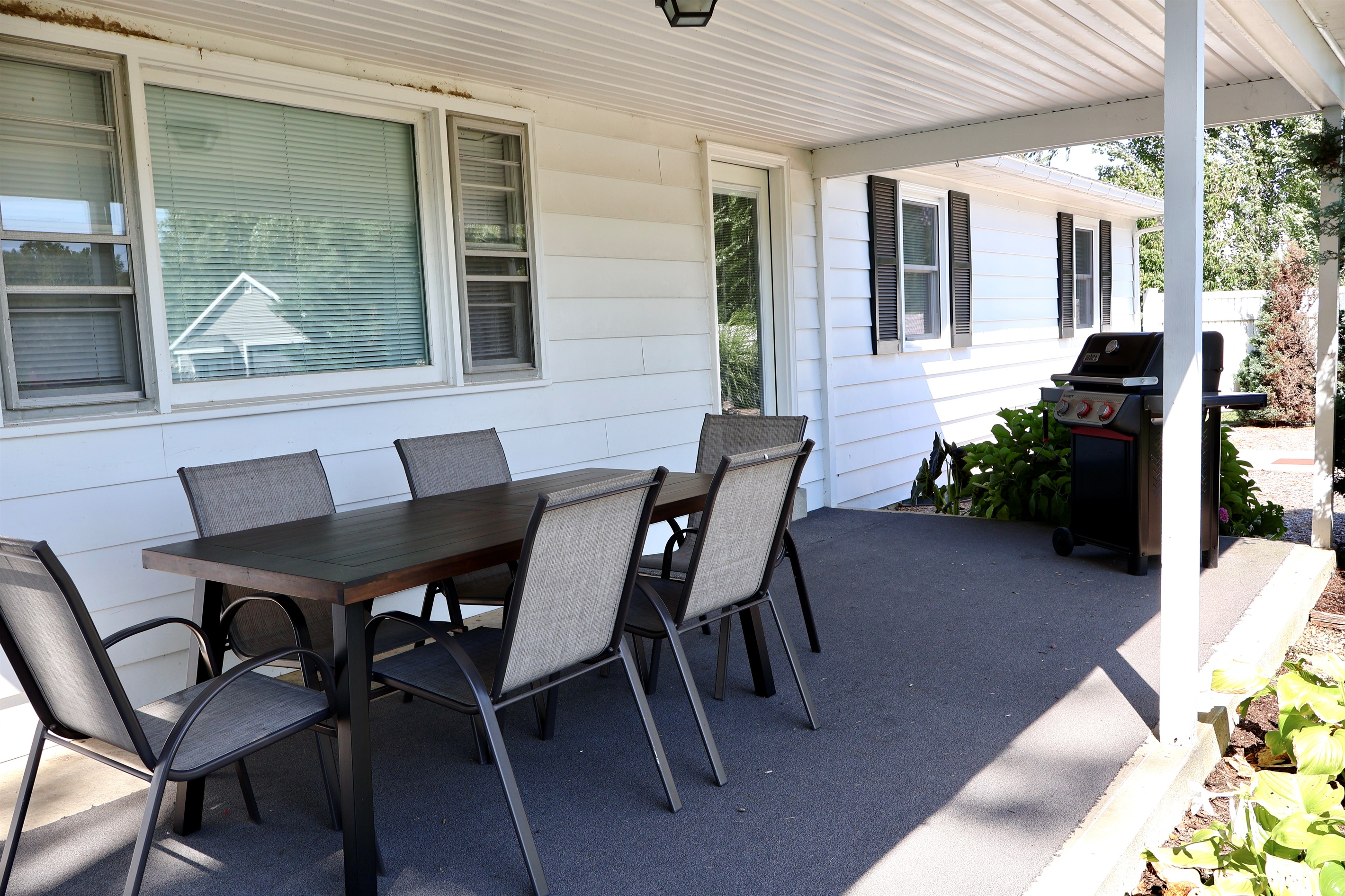 Covered Outdoor Dining Area with Weber Grill