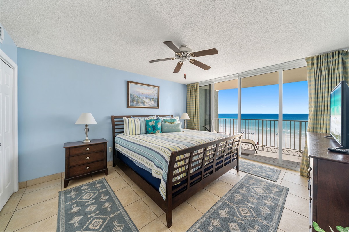 King master bedroom with en suite bathroom and floor to ceiling windows for the best beach views