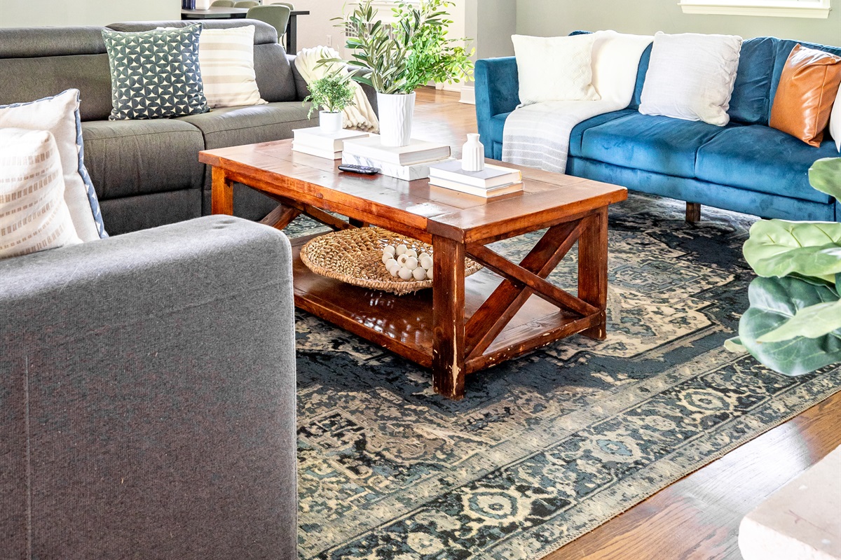Spacious living room with vaulted ceilings, game table, TV
