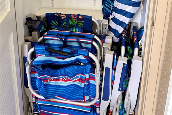 Beach chairs, umbrella and cooler.