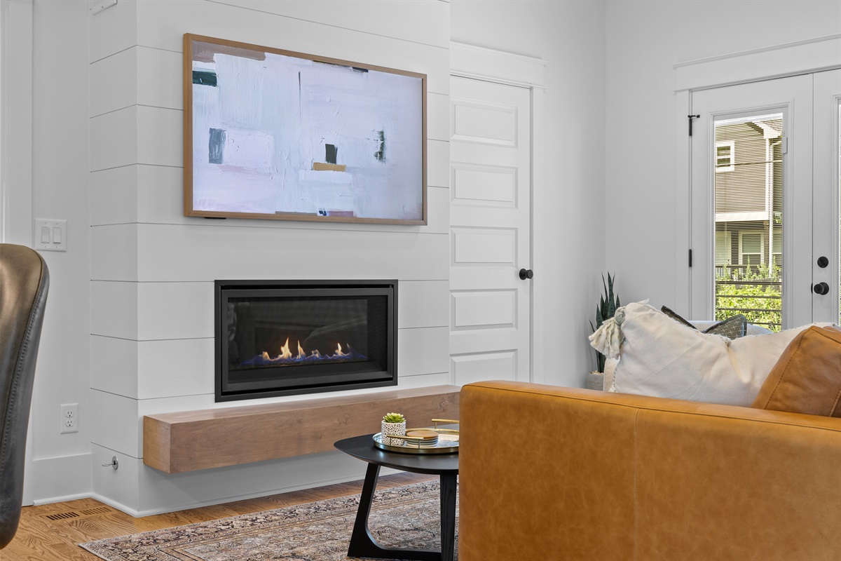 Art-mode Smart TV and cozy fireplace for relaxing nights.