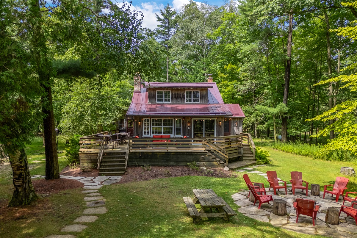 Wrap around porch with a variety of seating options to choose from.