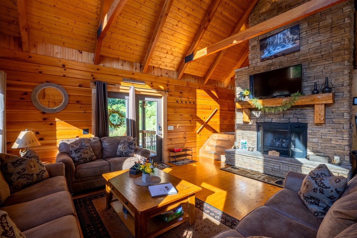 The smart tv is hung above the seasonal gas fireplace in the great room.