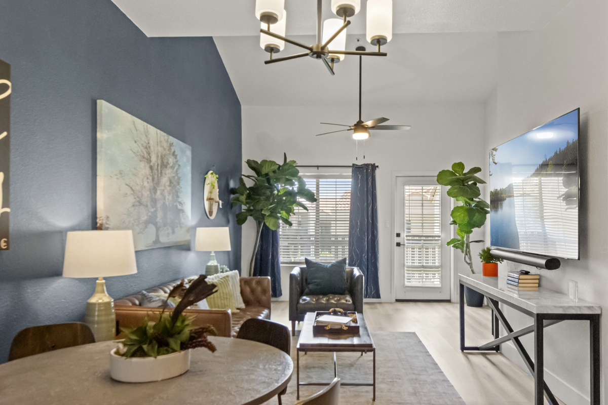 Open-concept living and dining area with comfortable seating, stylish décor, and plenty of space to gather and relax.