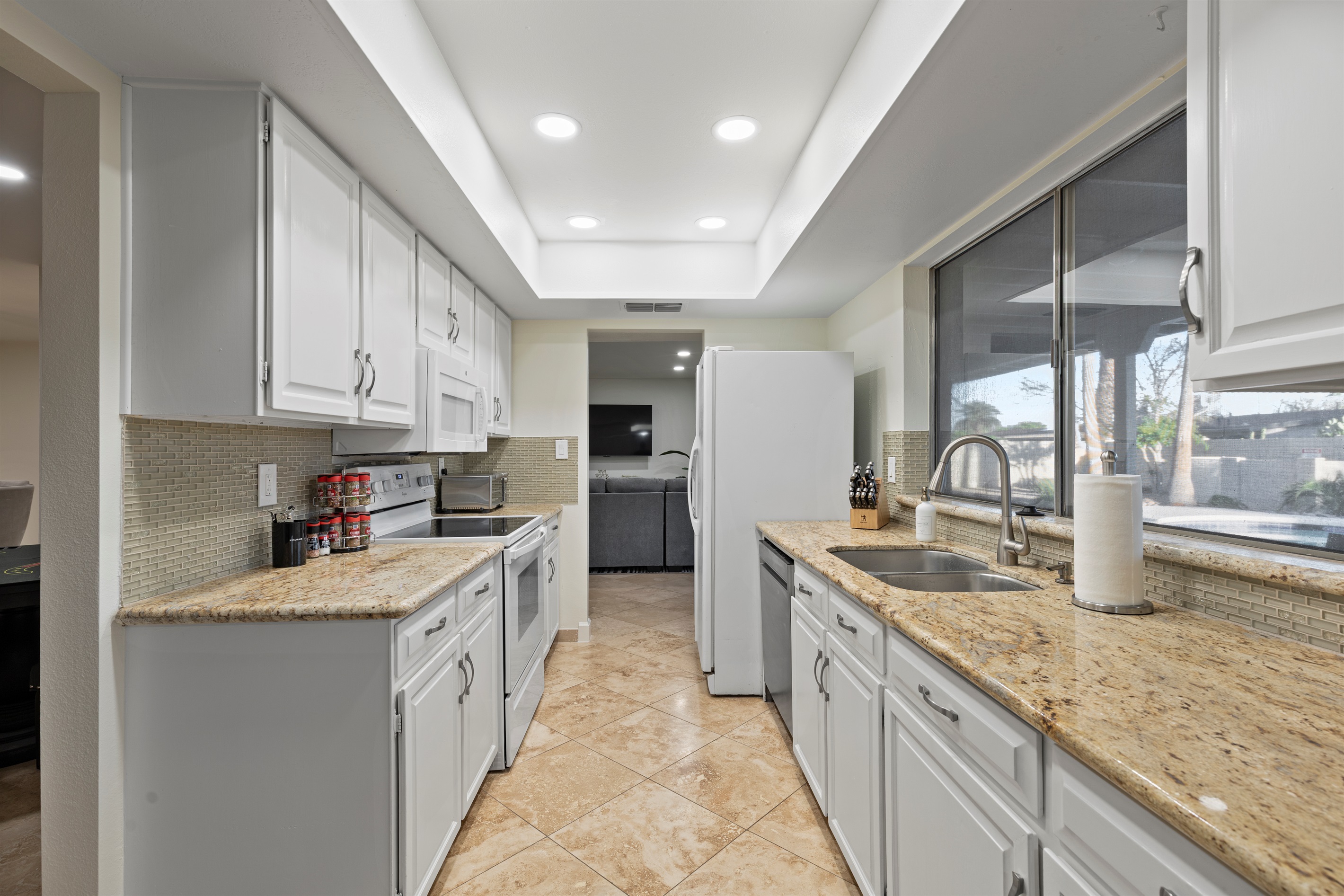 Fully equipped kitchen with ample counter space and modern appliances