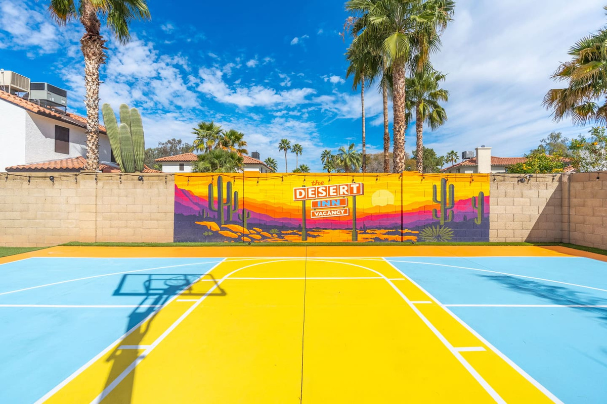 Full basketball court with vibrant desert mural—shoot hoops under Arizona skies with a view that rivals the game itself.