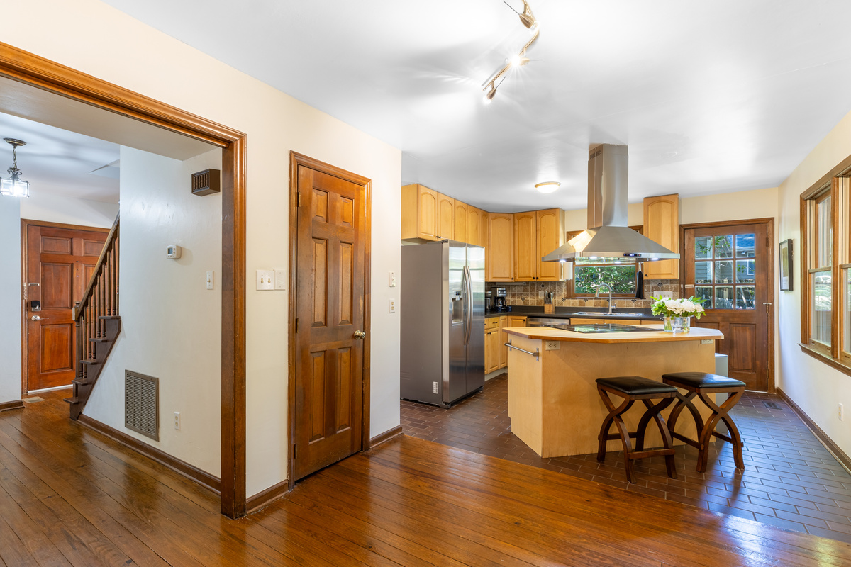 In addition to the dining room, there are seats at the kitchen bar and at a high-top table. 