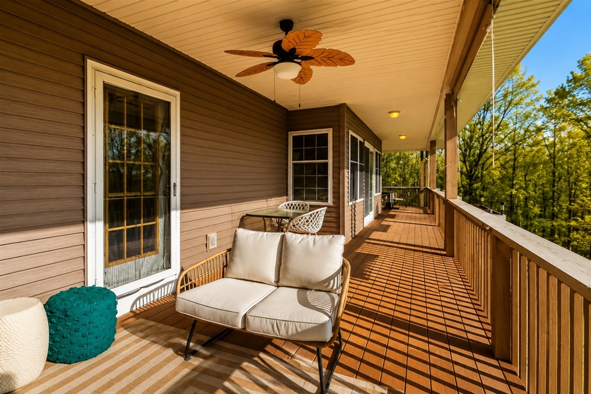 Relax on this spacious deck, equipped with comfortable and chic outdoor furniture, offering a serene spot to enjoy the natural surroundings and fresh air.