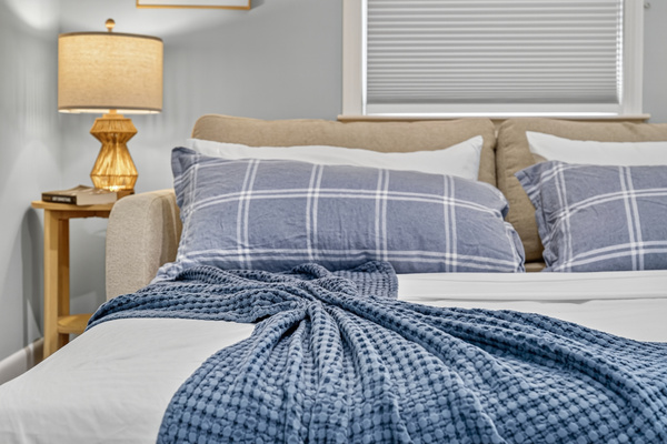 Soft, inviting linens promise a restful night's sleep.