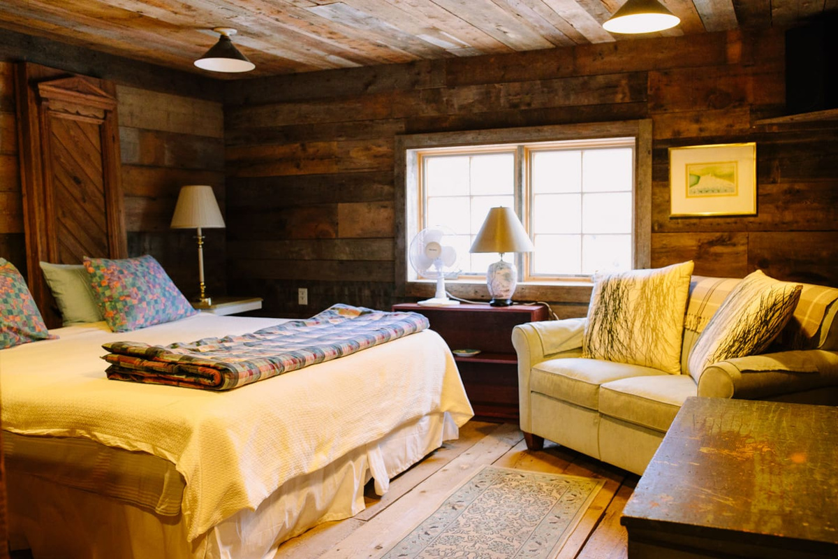 Master bedroom with king-size bed captures the morning light.