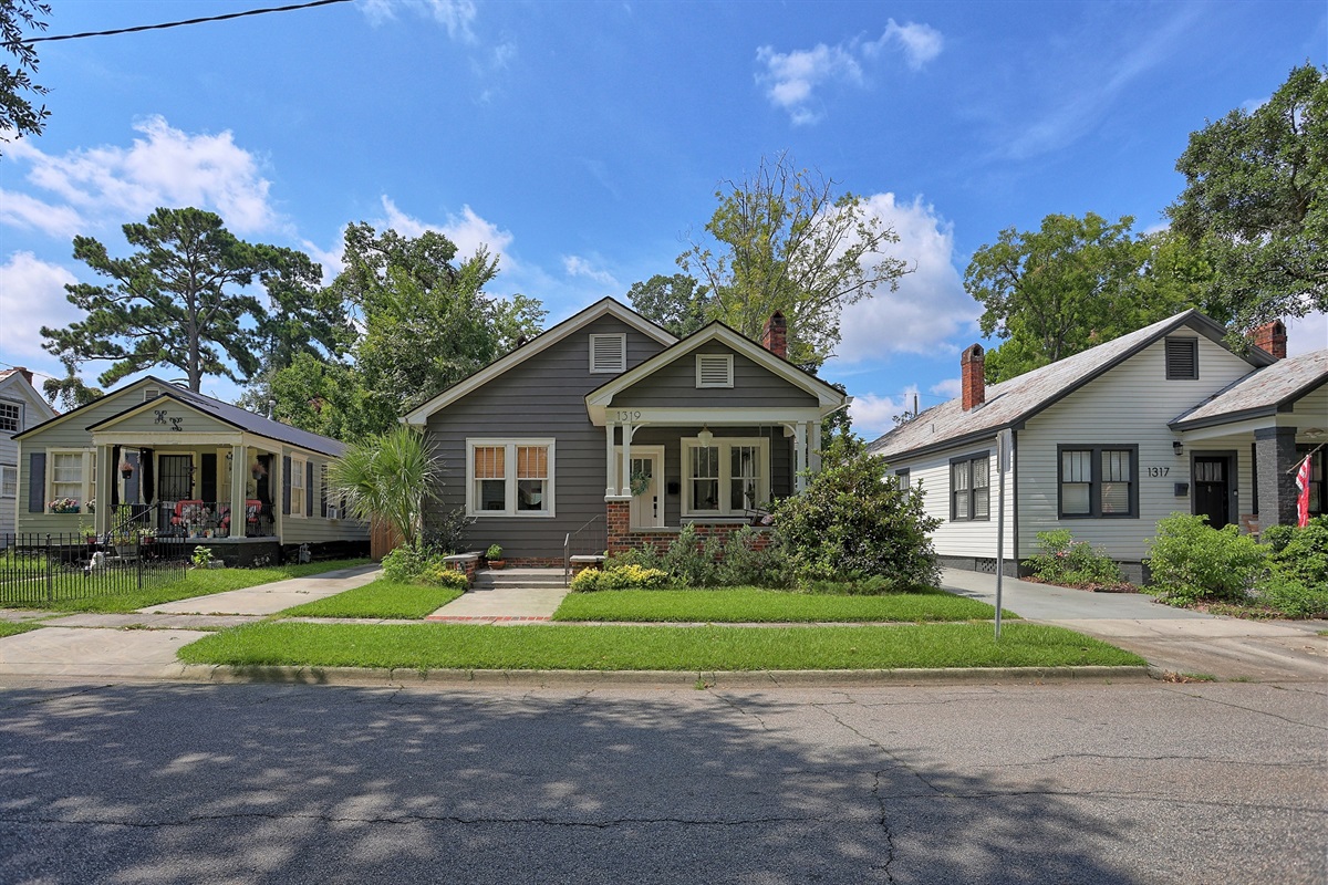 Classic curb appeal with a welcoming porch that invites you to experience true Southern hospitality.