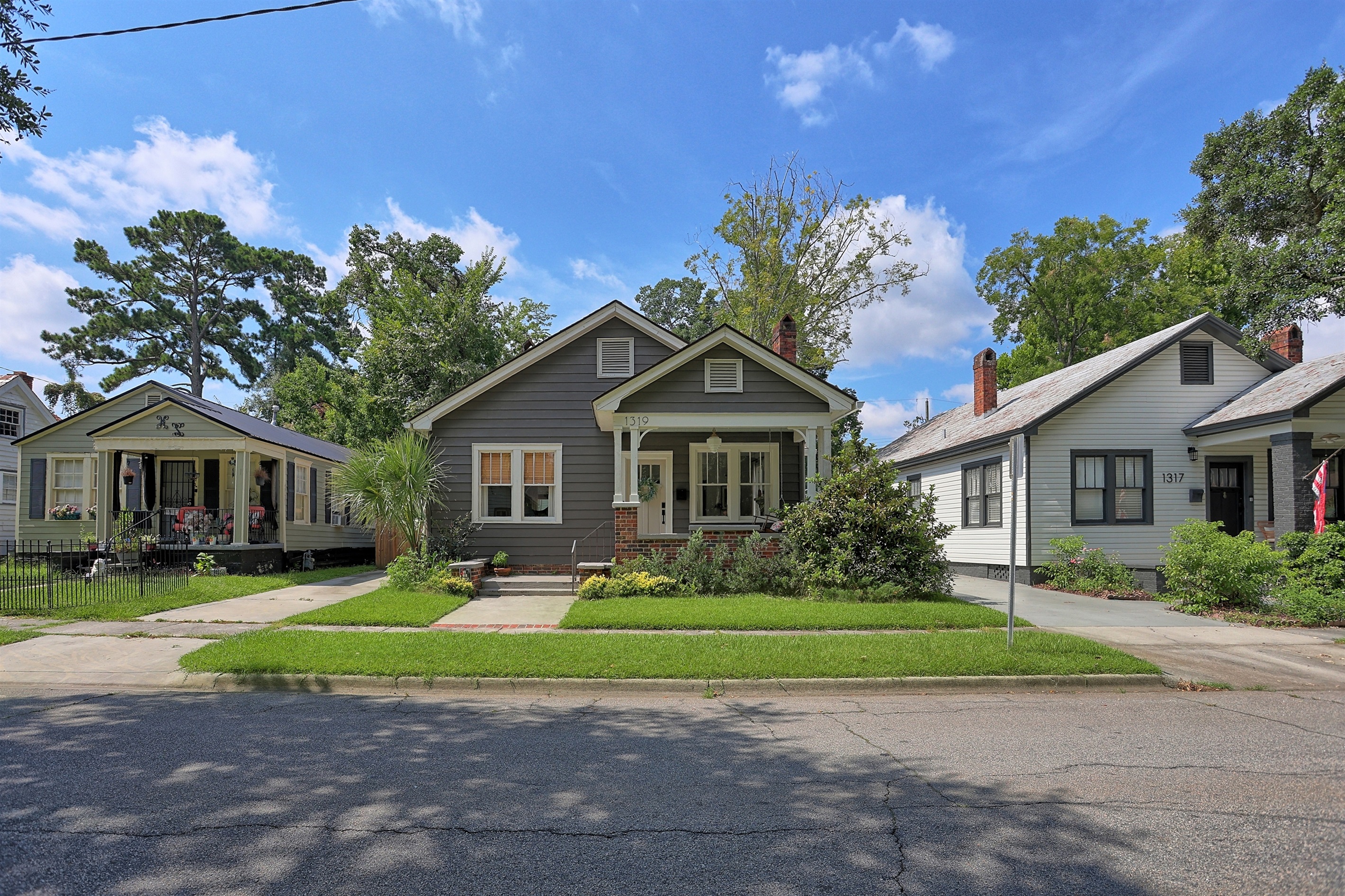 Classic curb appeal with a welcoming porch that invites you to experience true Southern hospitality.