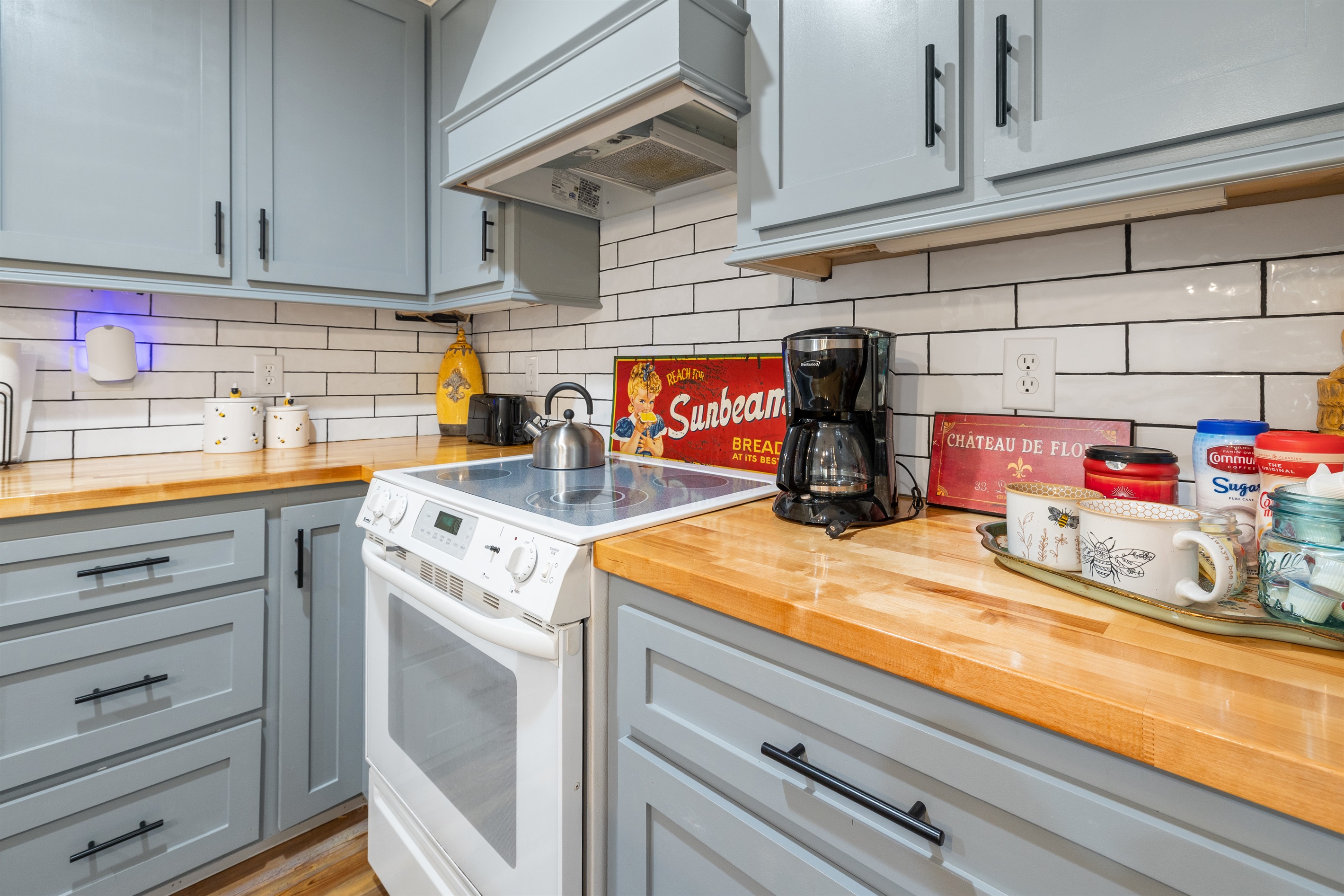 Your cooking space at Honeycomb—bright, clean, and equipped with an electric stove for stress-free meals.