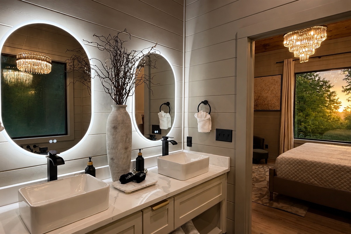 Luxury Bathroom: Experience elegance with dual sinks, stunning fixtures, and serene sunset views!