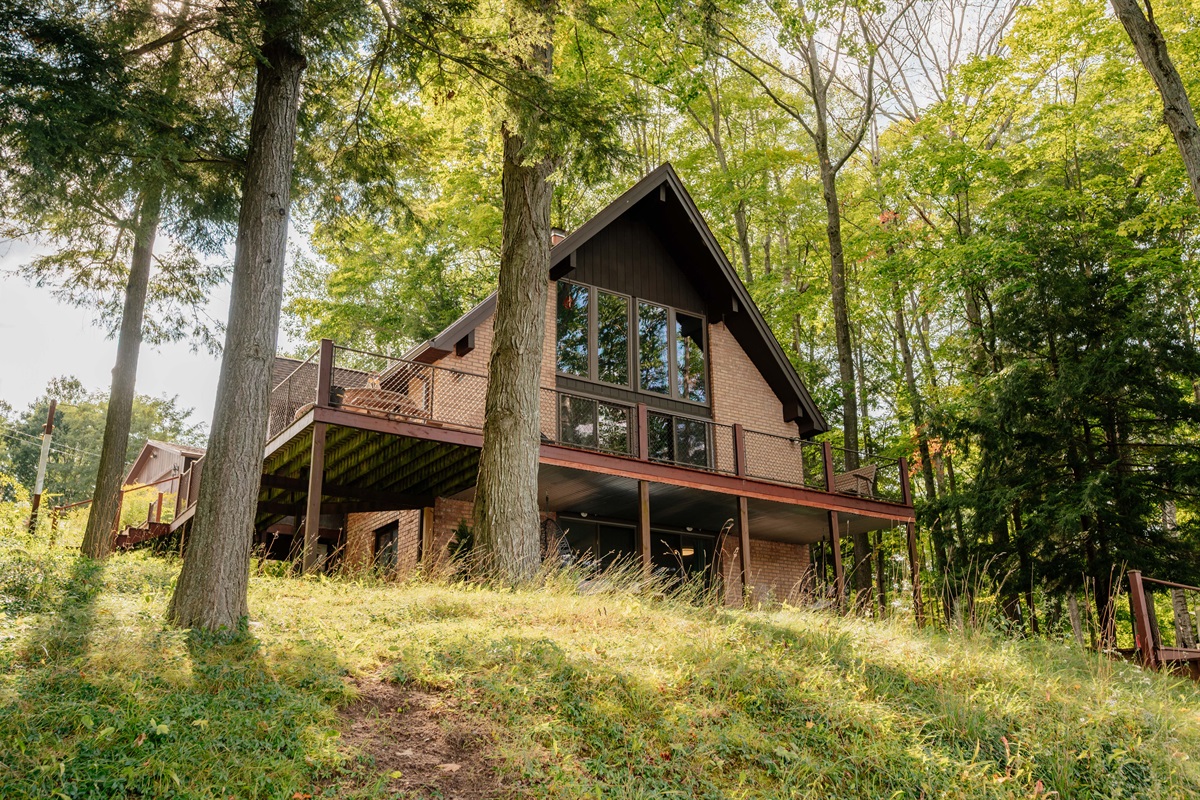 Side view of Loon’s Lakehouse nestled among the trees