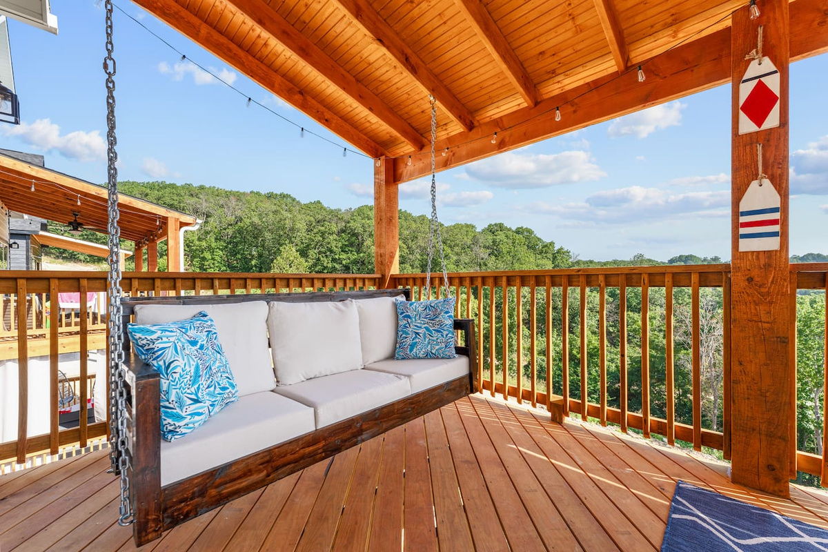Covered balcony with swing seating for morning coffee and evening unwinding