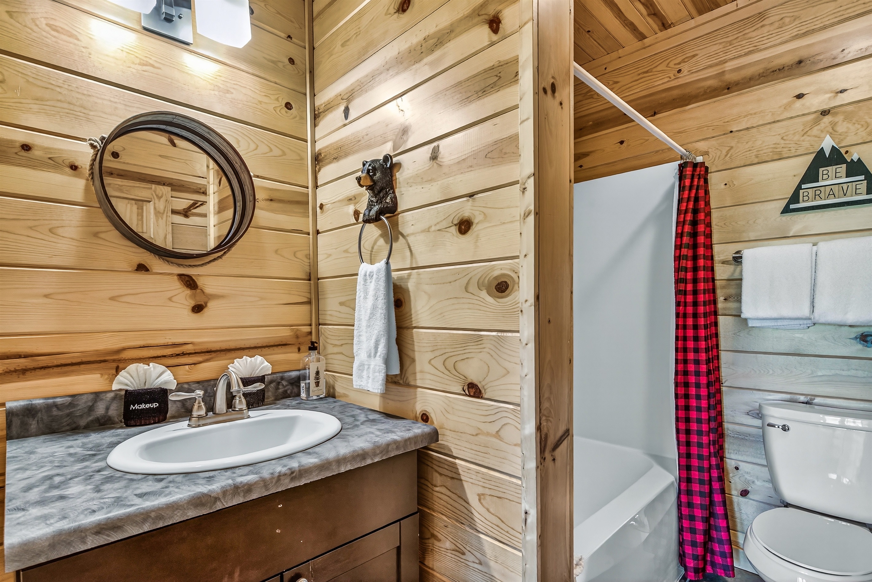 Bottom level ensuite bathroom with combo tub/shower
