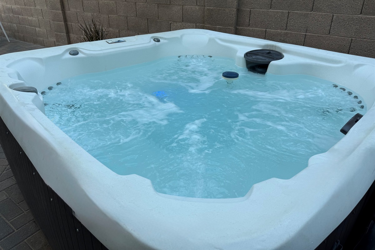 Hot tub is just one of amenities in the backyard. There is also a swimming pool that can be heated for an add'l fee; a large gas fire pit; ping pong, putting green, dining table, & TV (photos of all amenities coming soon!)