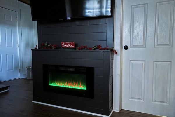 Enjoy the cozy electric fireplace in the family room downstairs. Turn on the blower to warm by the fire.