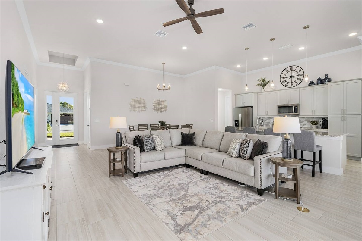 Luxury and entertainment merge seamlessly in this sleek TV-equipped living space