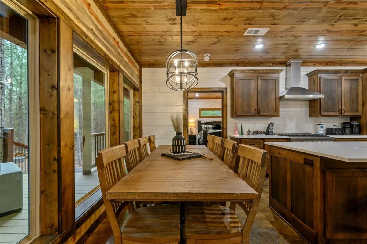 The large farmhouse table welcomes everyone to gather, share stories, and toast to time well spent.