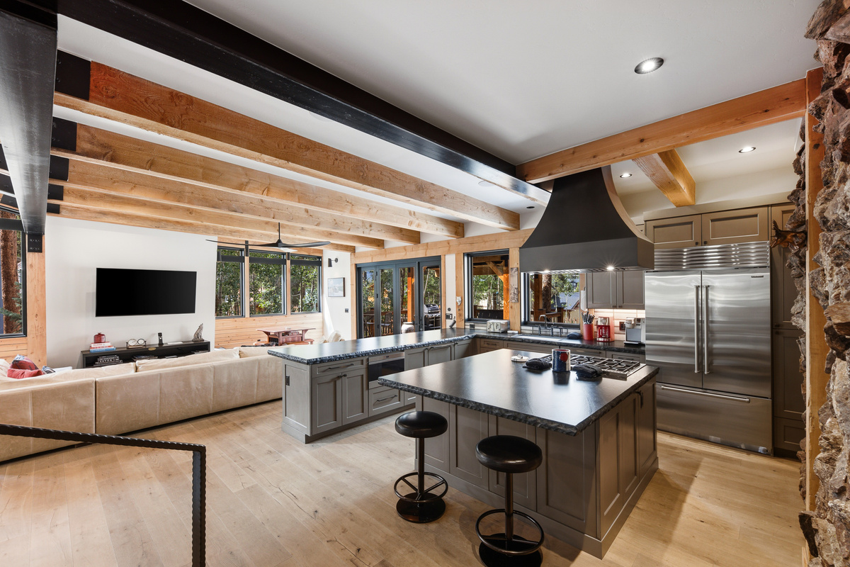 Chef's kitchen with large island, bar seating, dual dishwashers and spacious pathways for comfortable flow