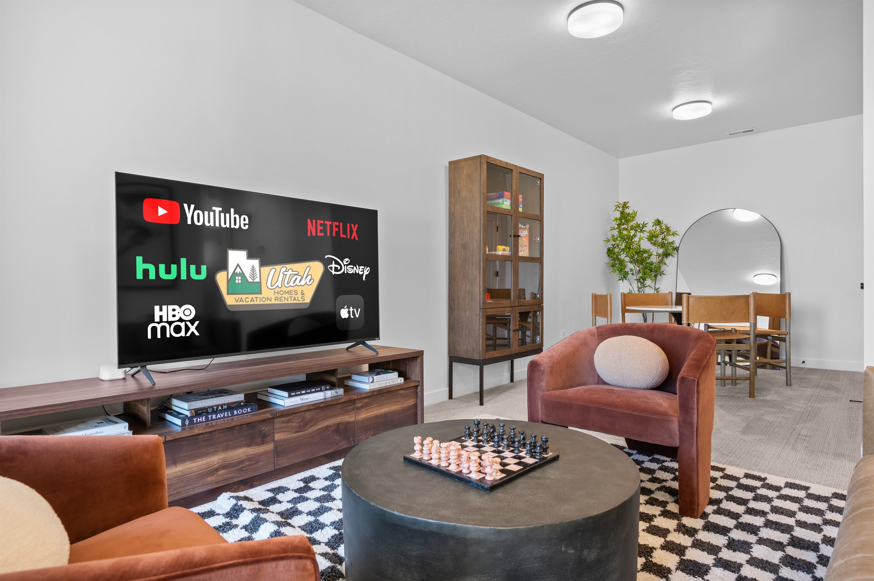 This game lounge combines modern comfort with mountain-inspired touches.