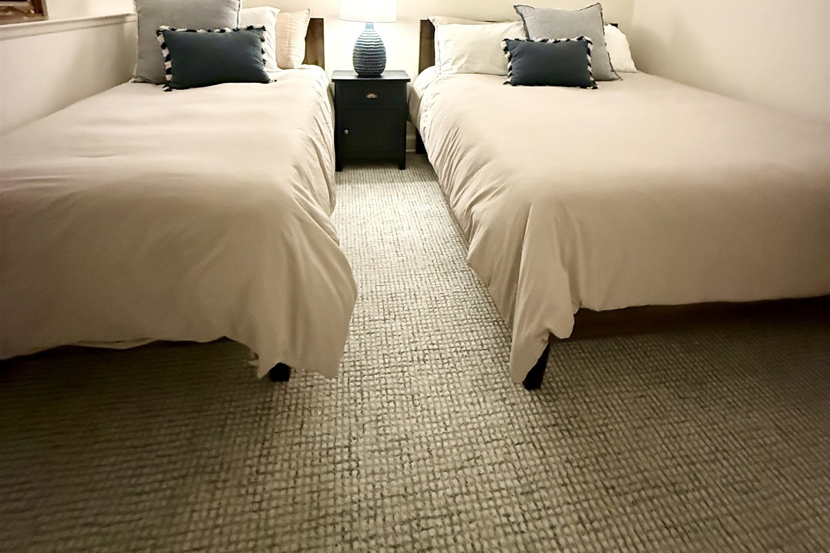 Our 2nd bedroom contains one queen bed and one twin XL with premium mattresses, a 55"smart TV with Disney Plus, Hulu, Peacock, Max and Amazon Prime as well as a PlayStation 4 for "down time."