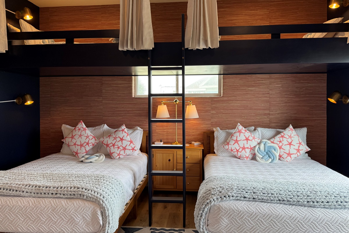 The Fishing Pier sleeps 6. Two Queens on the bottom and above are extra long twins. Pull the curtains for privacy up top!  Each bed has its own reading lamp also. 