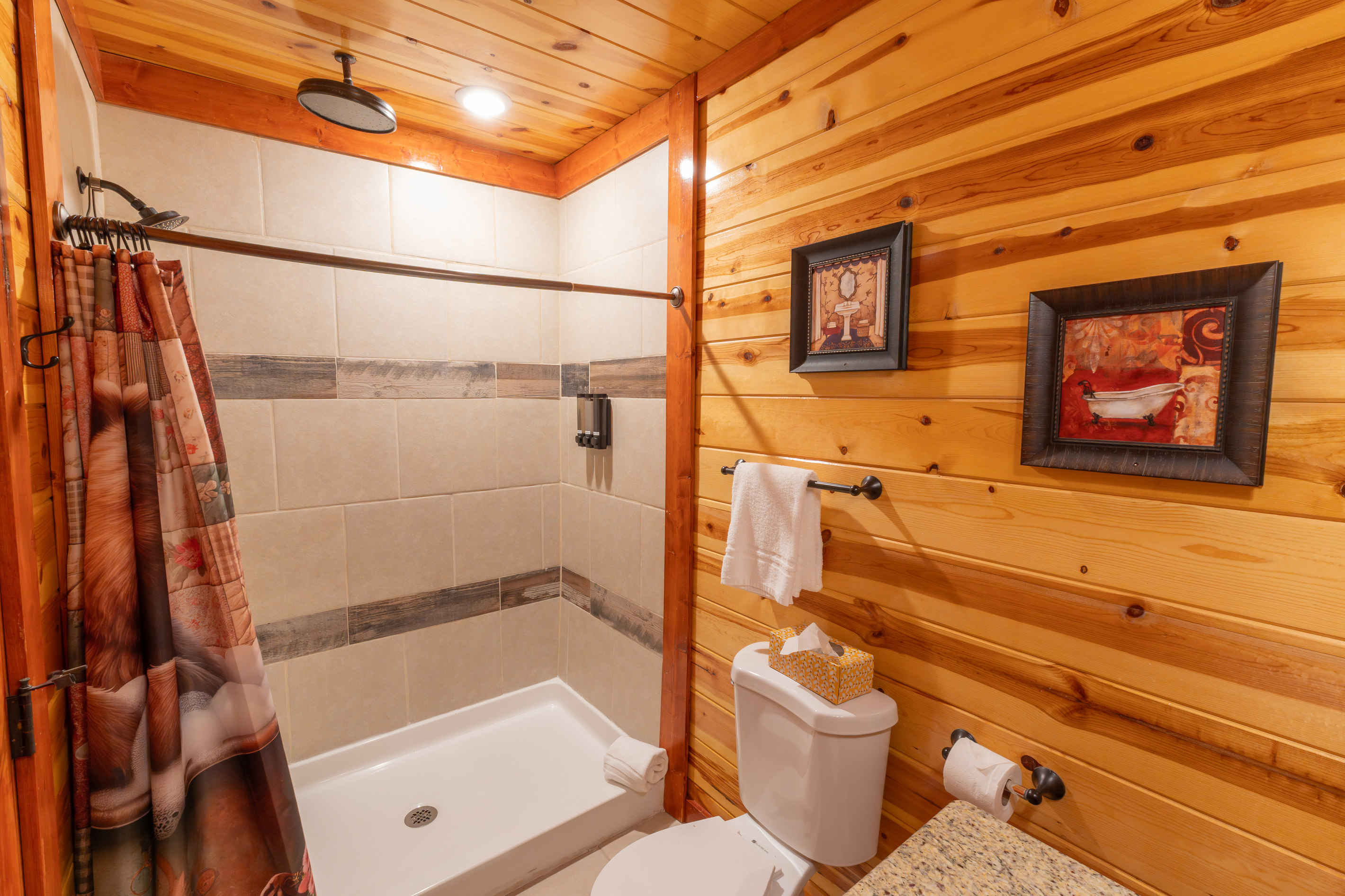 Even the bunkroom ensuite bathroom features a luxurious dual rainfall shower.