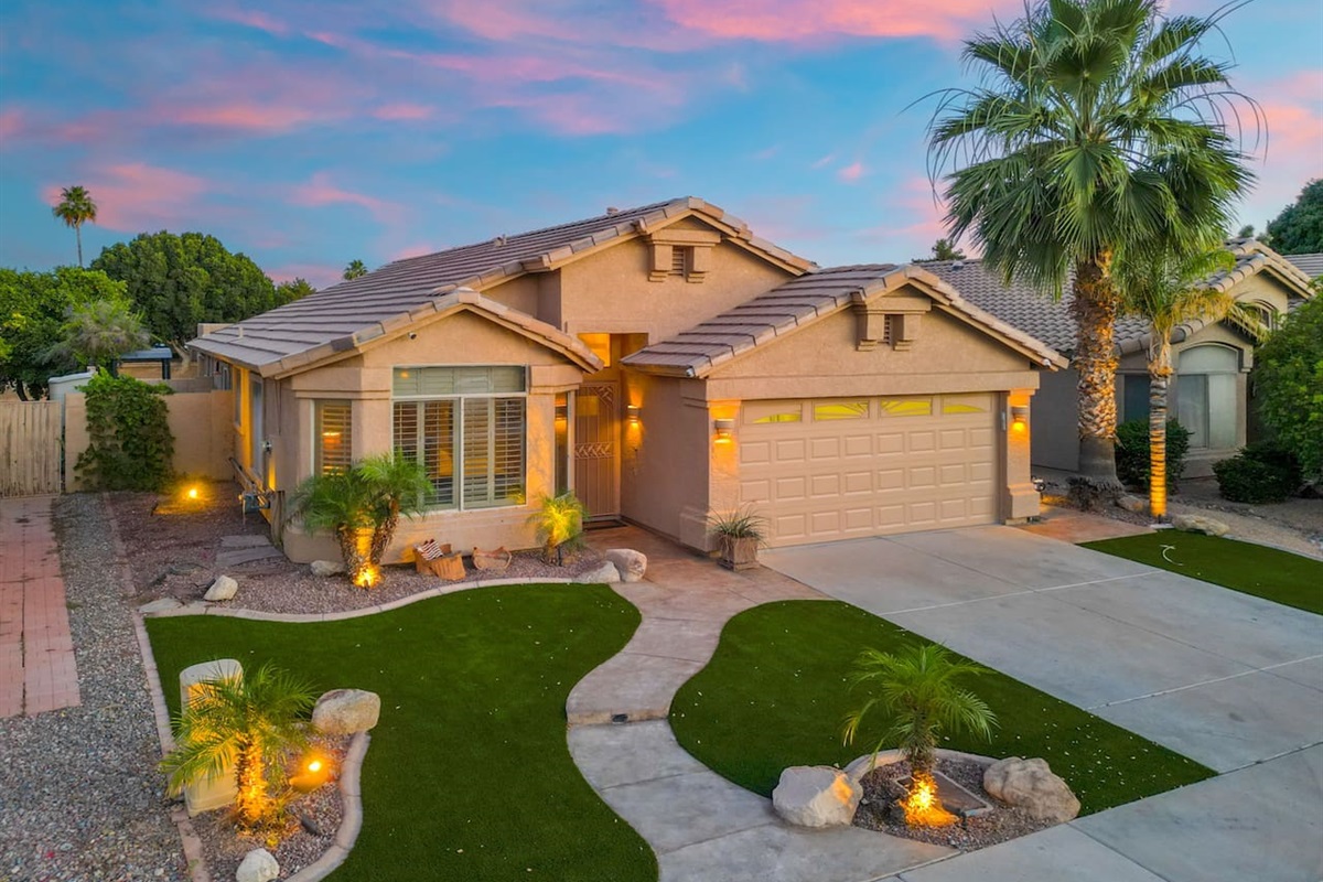 As the Arizona sky puts on its nightly show, the home glows with warm exterior lighting — a picture-perfect arrival that makes a great first impression every single time.