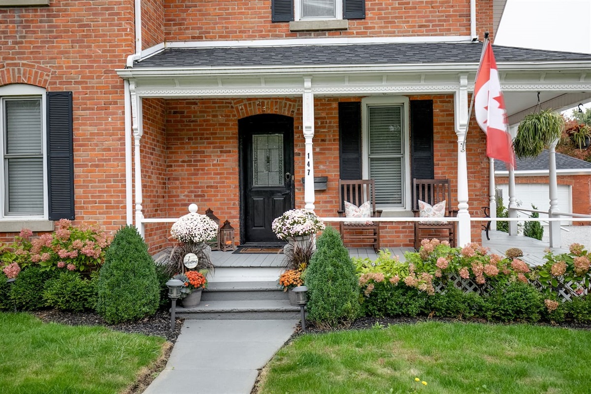 Front Exterior with Rocking Chairs