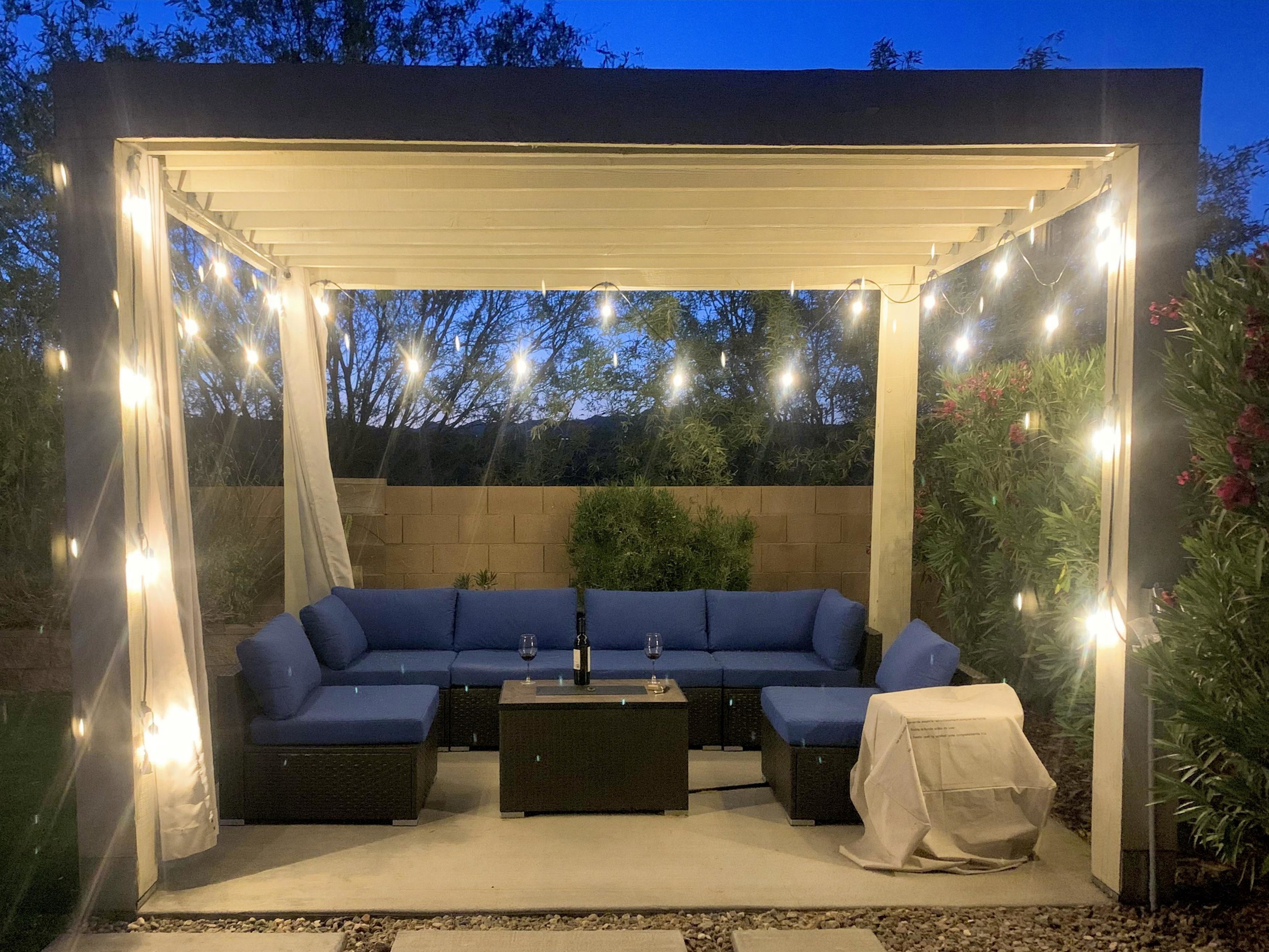 Relax with a bottle of wine under the pergola. When it's cool the firepit table keeps things cozy.