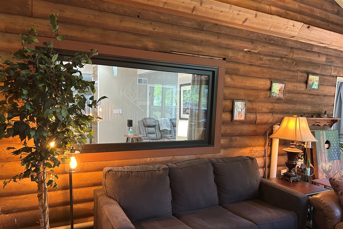 The window between the Guest Quarters and sunroom has room darkening curtains.