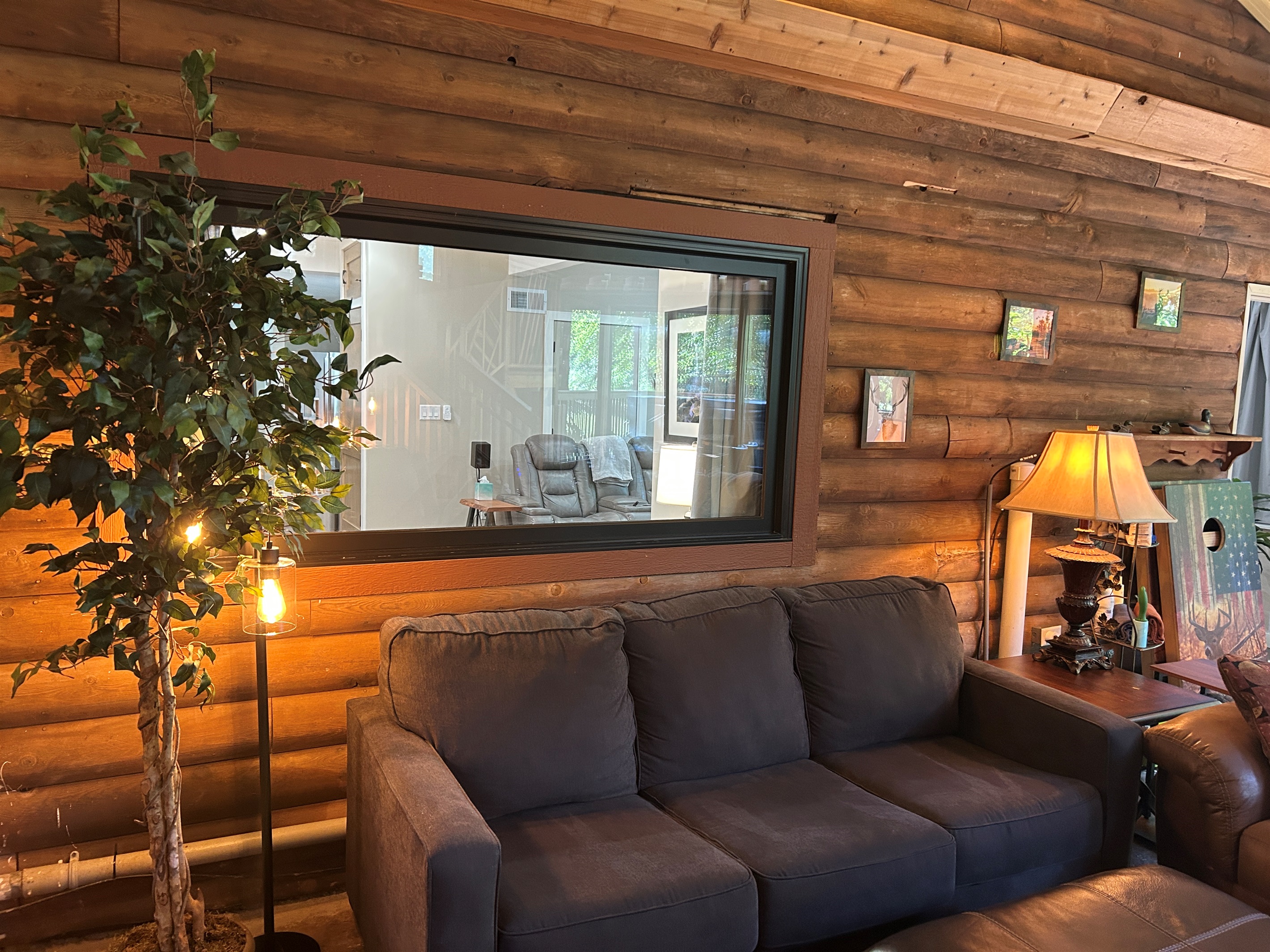 The window between the Guest Quarters and sunroom has room darkening curtains.